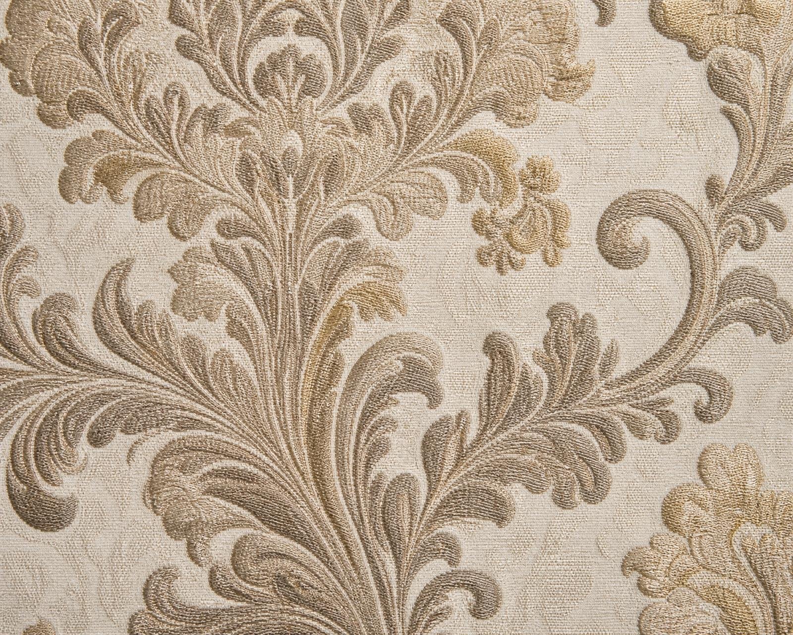 Macro detail of heritage damask wallpaper with scrolling acanthus motif in taupe and faint gold