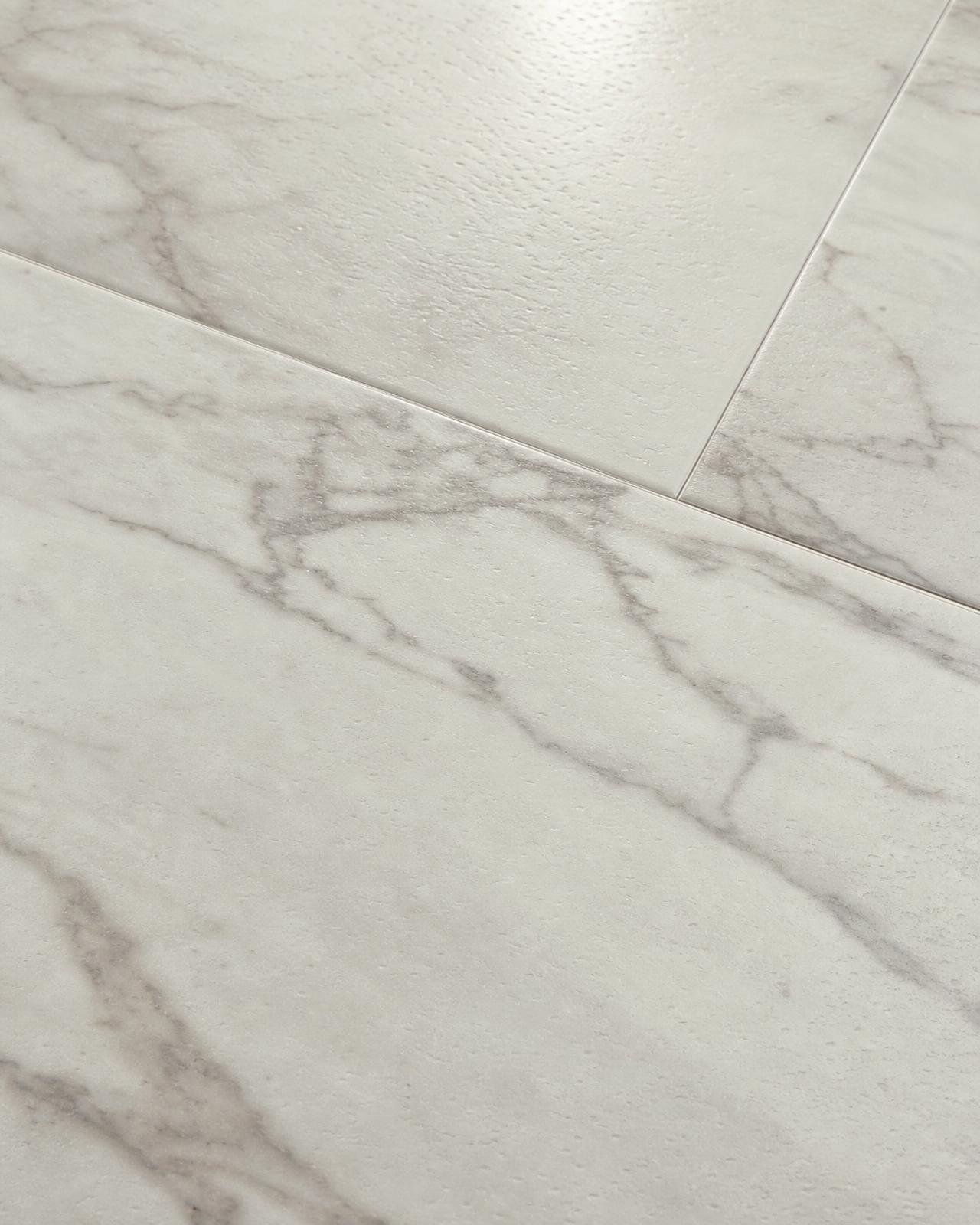 Macro of stone-effect luxury vinyl flooring with realistic marble veining and satin finish