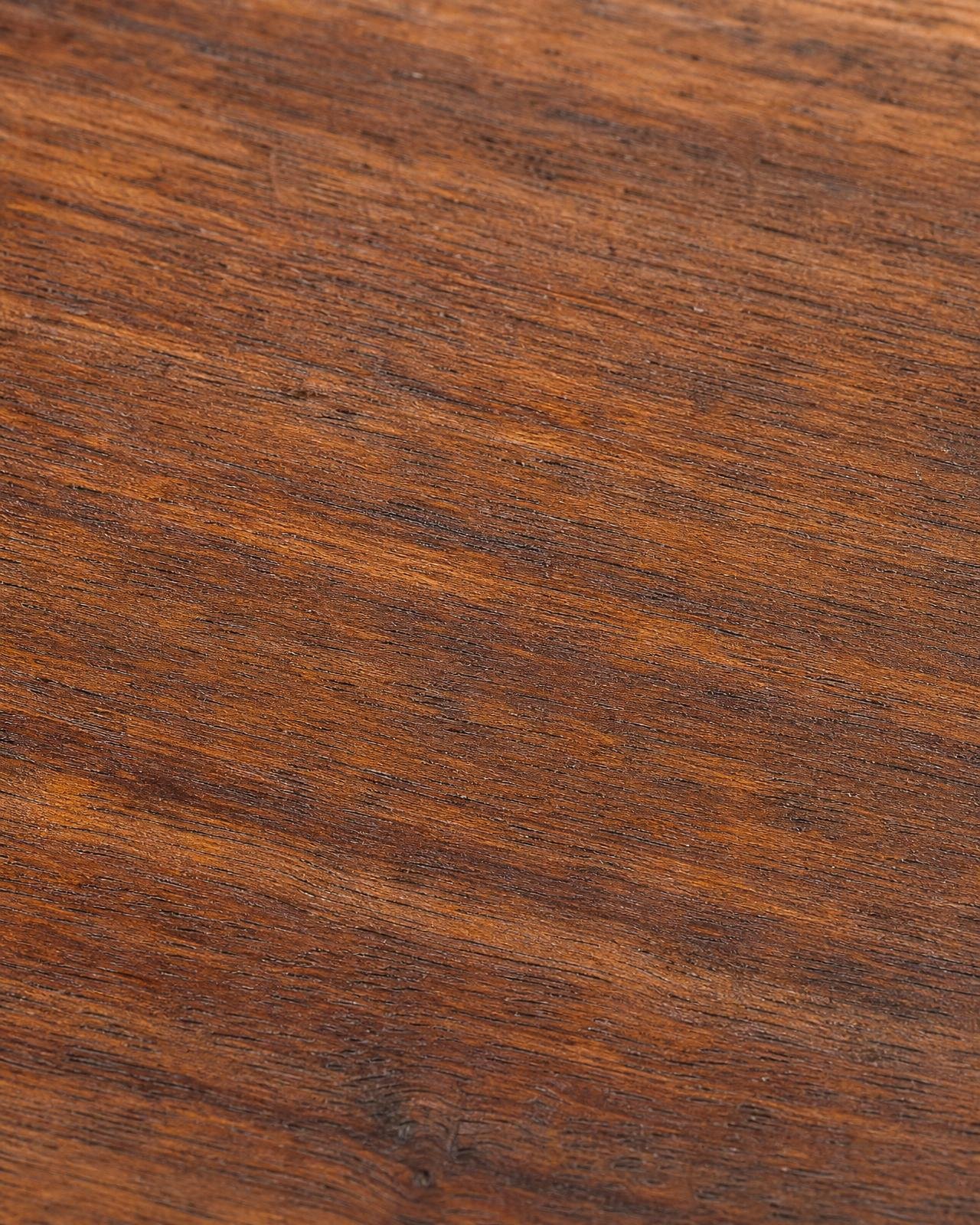Macro of rich amber ipe outdoor decking grain with brushed surface texture