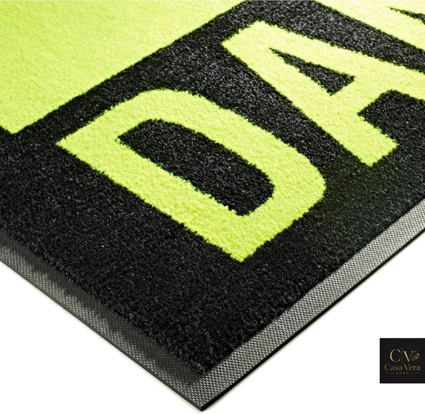 Close view of bright yellow safety lettering printed into a black high-visibility mat