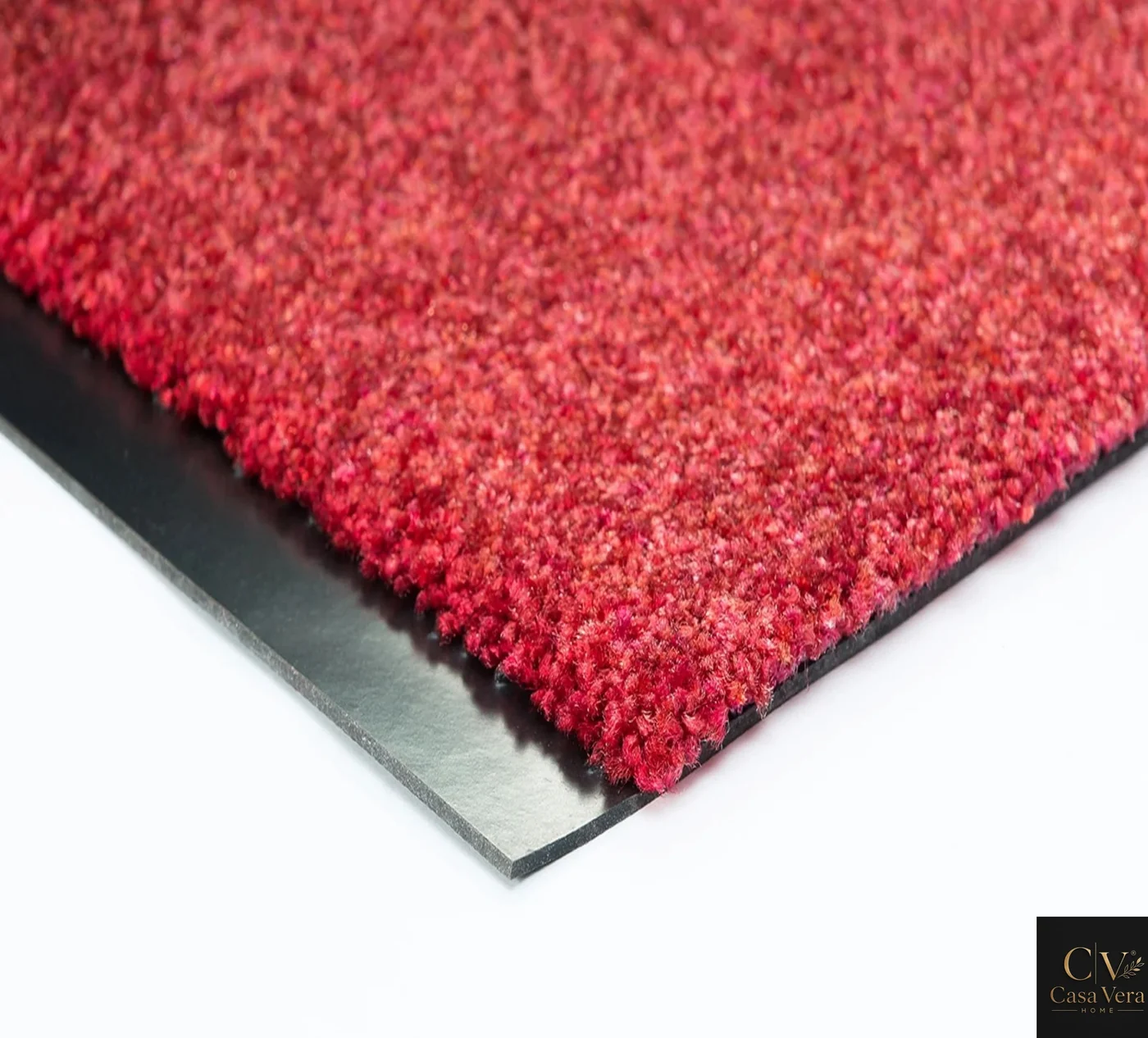 Corner detail of a red Horizon runner mat showing dense pile and bound edge
