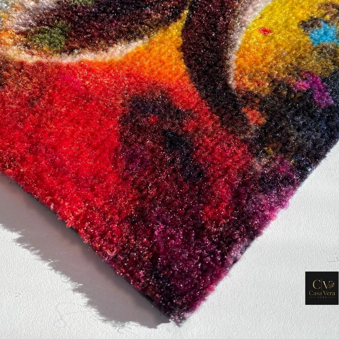 Corner detail of a vividly printed Jet Luma mat showing dense coloured pile
